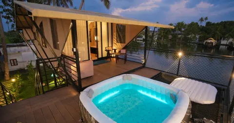 A River Bells luxury backwater glamp raised over the Alleppey backwaters